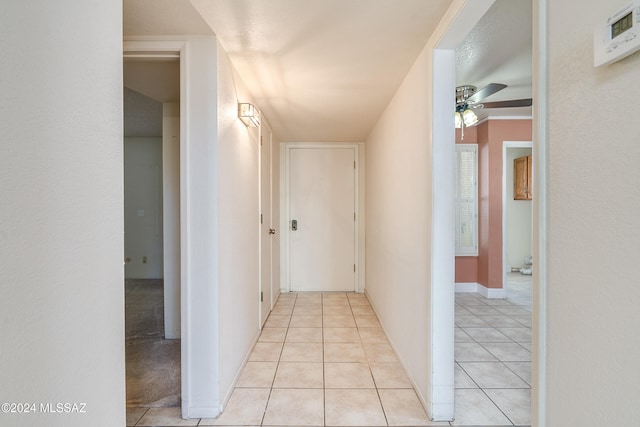 hallway featuring light tile patterned floors