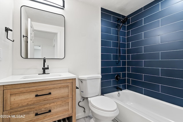 full bathroom featuring vanity, toilet, and tiled shower / bath