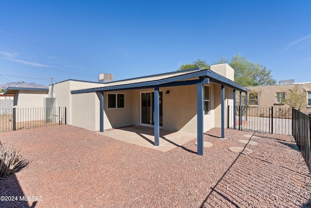 rear view of house featuring a patio