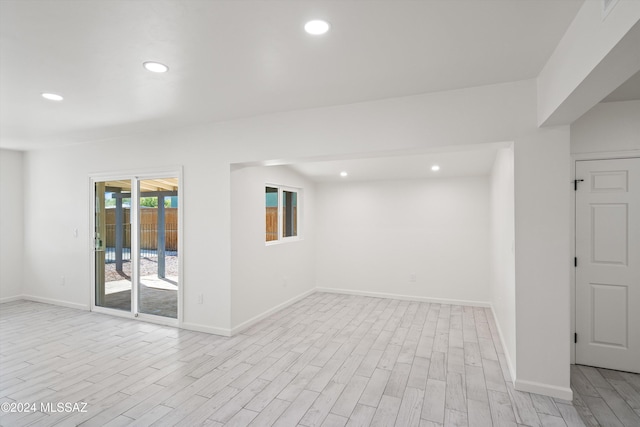 spare room with light wood-type flooring