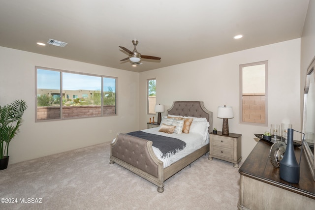 bedroom featuring ceiling fan and light colored carpet