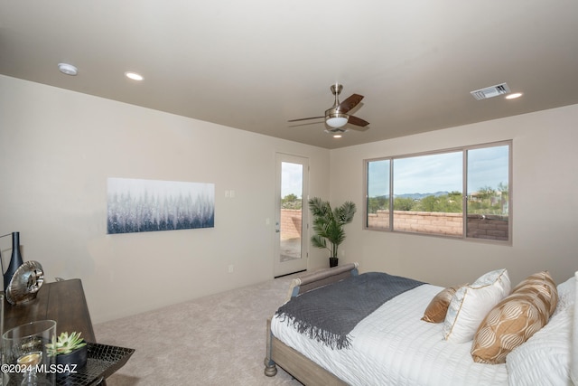 carpeted bedroom featuring ceiling fan and access to outside