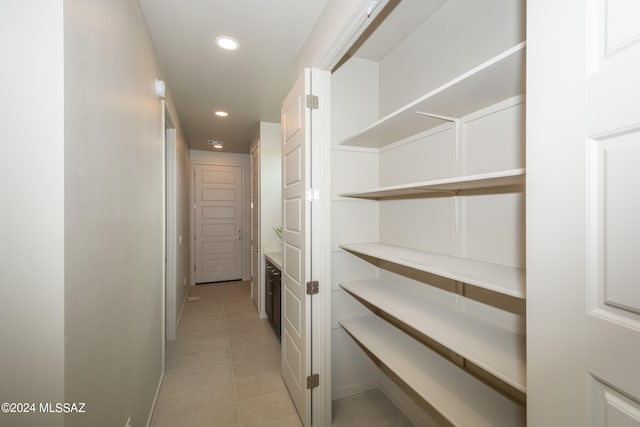 hallway featuring light tile patterned floors