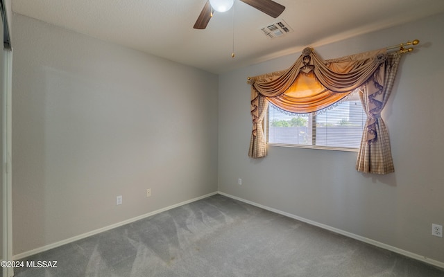 carpeted empty room with ceiling fan