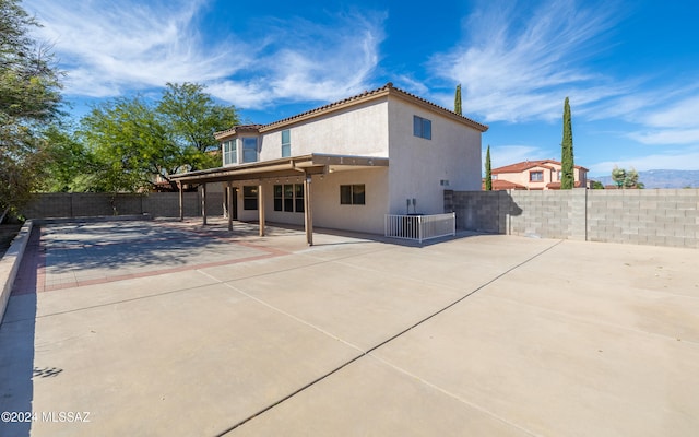 rear view of house featuring a patio