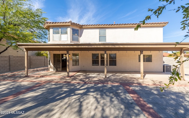 rear view of property with a patio area