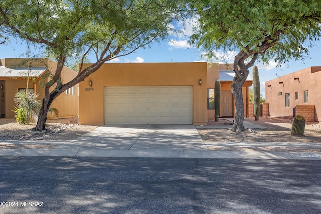 southwest-style home with a garage