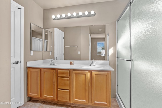 bathroom with vanity, tile patterned flooring, and an enclosed shower