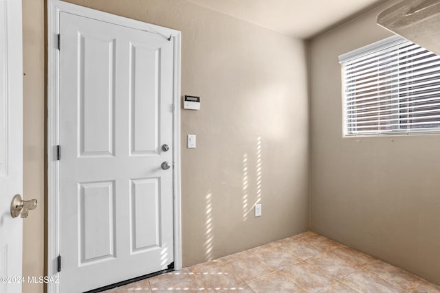 interior space featuring light tile patterned flooring