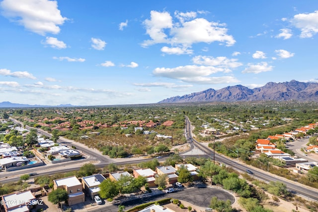 birds eye view of property with a mountain view