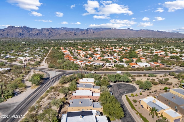 birds eye view of property featuring a mountain view