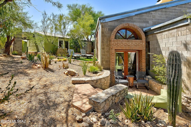 view of yard featuring french doors and a patio area