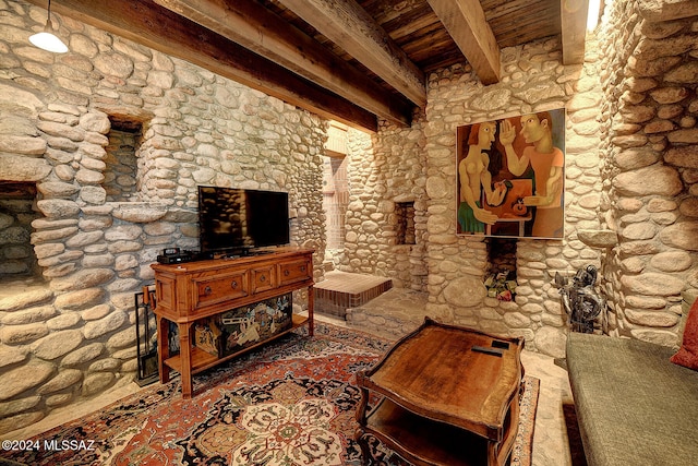 living room with beamed ceiling and wooden ceiling