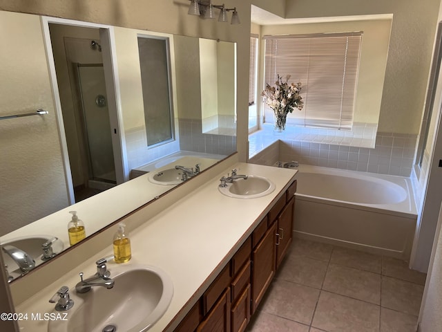 bathroom with vanity, shower with separate bathtub, and tile patterned flooring