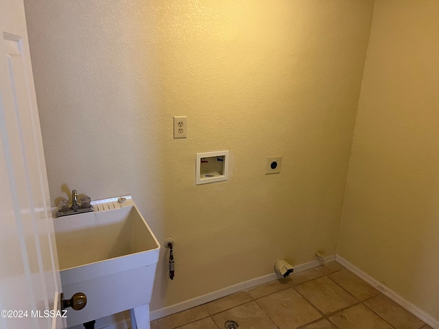 laundry room with hookup for an electric dryer, sink, washer hookup, and light tile patterned floors