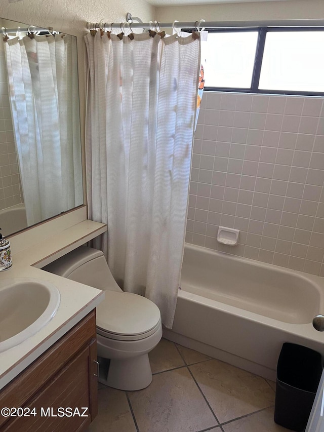 full bathroom with vanity, toilet, shower / bath combo, and tile patterned flooring