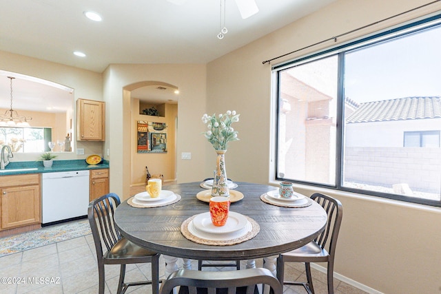 dining area with a ceiling fan, arched walkways, recessed lighting, and light tile patterned flooring