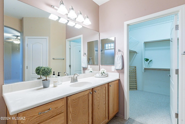 bathroom featuring vanity and ceiling fan