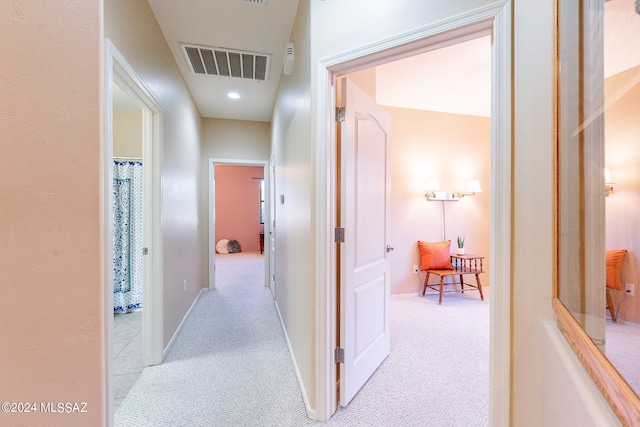 hall featuring recessed lighting, visible vents, carpet flooring, and baseboards