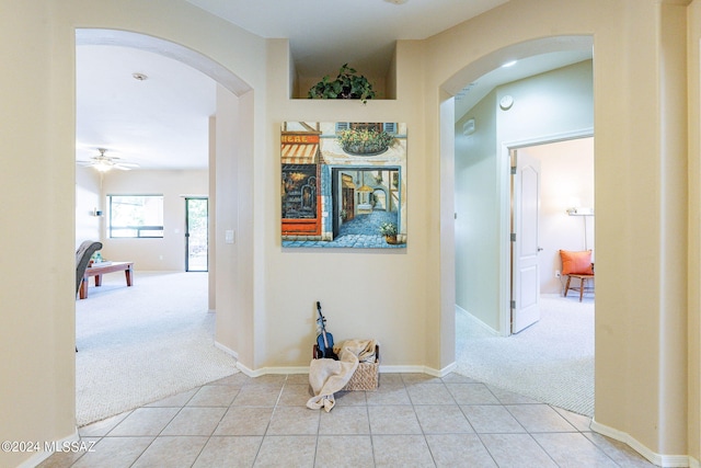 hall featuring light tile patterned floors