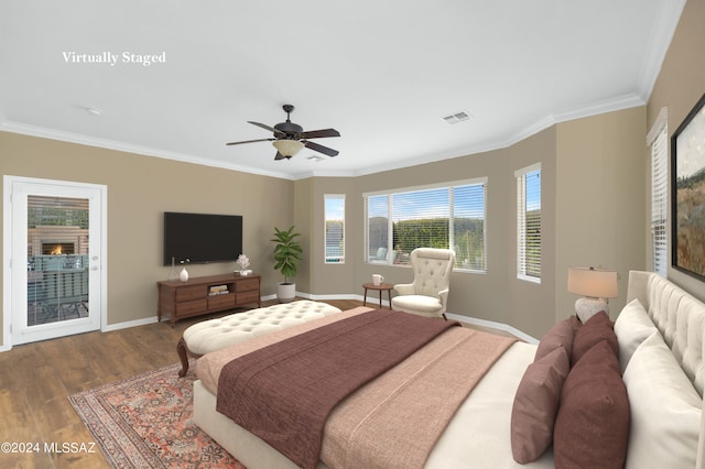 bedroom featuring ornamental molding, hardwood / wood-style floors, access to exterior, and ceiling fan