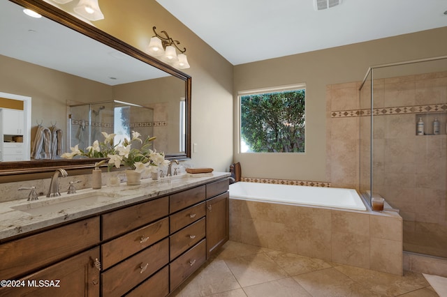 bathroom with vanity, tile patterned floors, and separate shower and tub