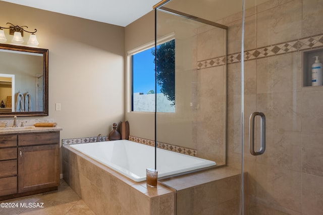 bathroom featuring vanity, shower with separate bathtub, and tile patterned flooring