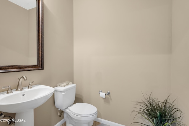 bathroom with toilet and sink