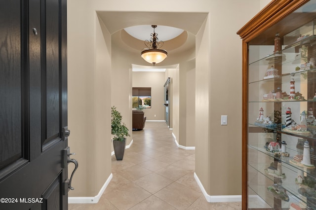 corridor with light tile patterned floors