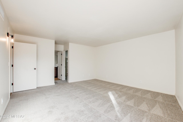 empty room featuring light colored carpet