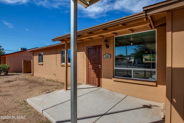 entrance to property featuring a patio area