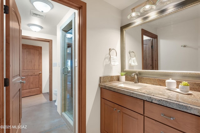 702 W Cresta Loma Dr, Tucson, AZ 85704 - bathroom featuring visible vents, vanity, finished concrete flooring, toilet, and a shower stall