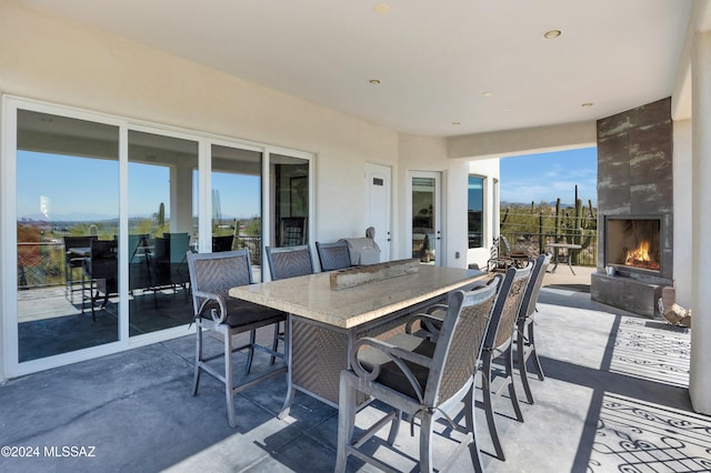 view of patio / terrace featuring a fireplace