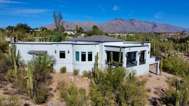 rear view of property with a mountain view