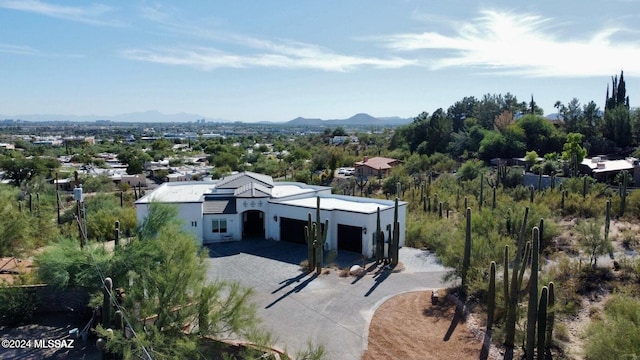 birds eye view of property featuring a mountain view