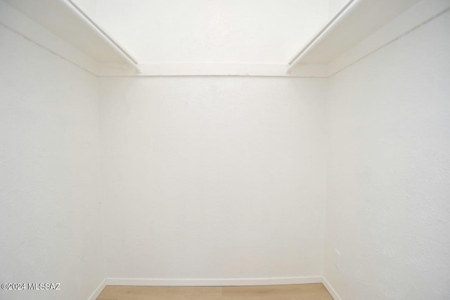 walk in closet featuring wood-type flooring