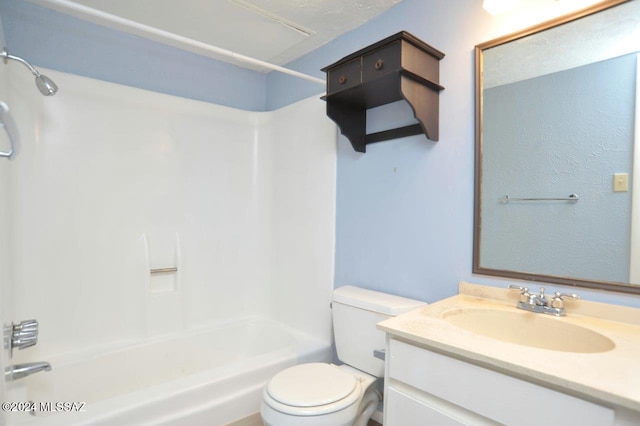 full bathroom with vanity, toilet, a textured ceiling, and bathing tub / shower combination