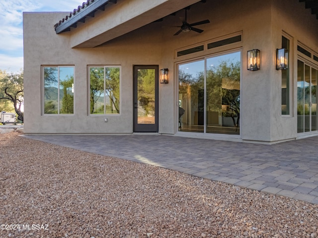 exterior space with a patio area and ceiling fan