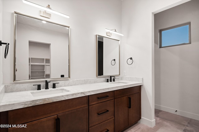 bathroom with vanity and tile patterned floors