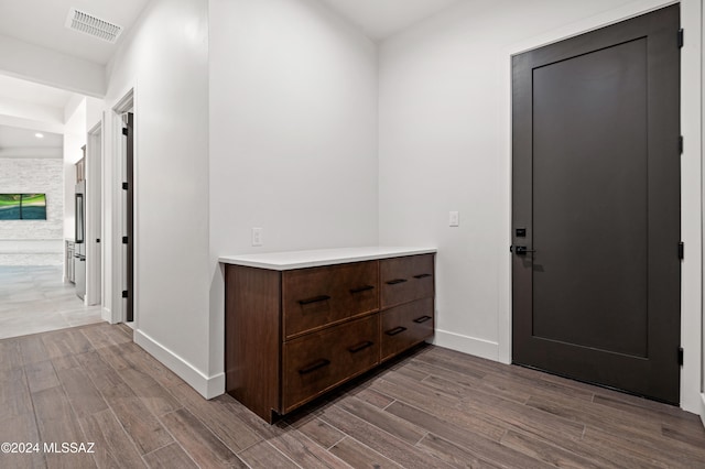 foyer with dark hardwood / wood-style flooring