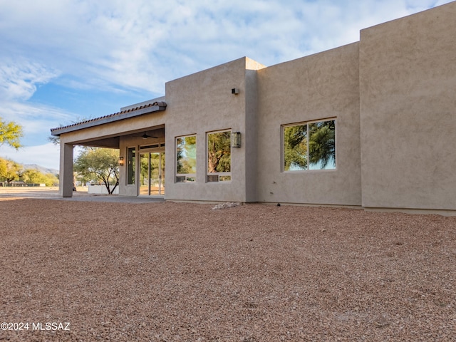 back of property featuring a patio