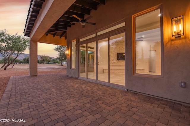 patio terrace at dusk with ceiling fan