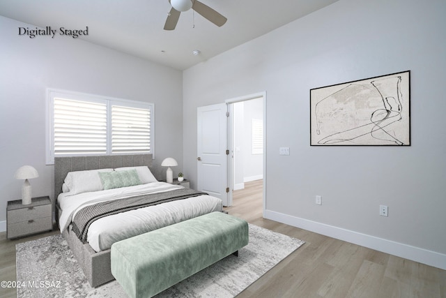 bedroom featuring light wood-type flooring and ceiling fan