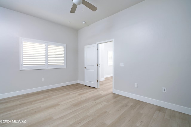 spare room with light hardwood / wood-style flooring and ceiling fan