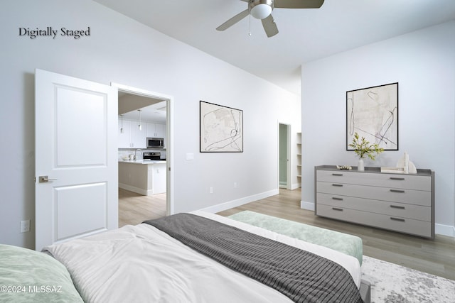 bedroom featuring light hardwood / wood-style floors and ceiling fan