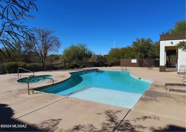 view of pool featuring a patio