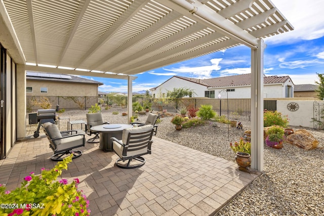 view of patio with a fire pit and a pergola