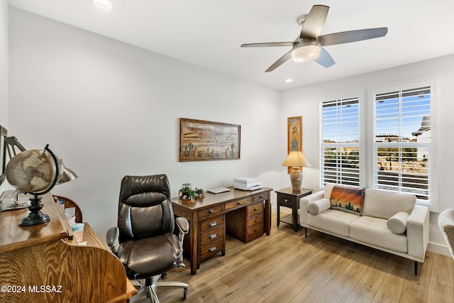 office featuring light wood-type flooring and ceiling fan