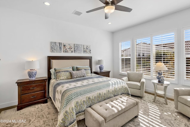 bedroom with light wood-type flooring and ceiling fan