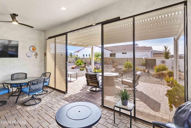 view of patio / terrace featuring ceiling fan